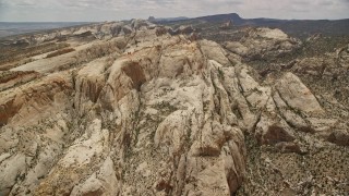 AX130_309E - 5.5K aerial stock footage fly to the Waterpocket Fold rock formations, Capitol Reef National Park, Utah