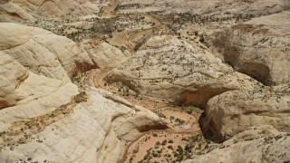 AX130_314 - 5.5K aerial stock footage orbit canyon twisting through Waterpocket Fold rock formations, Capitol Reef National Park, Utah