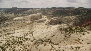 AX130_328 - 5.5K aerial stock footage of rock formations at Waterpocket Fold, Capitol Reef National Park, Utah