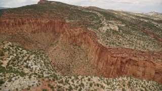 AX130_329E - 5.5K aerial stock footage approach and flying down deep canyon, Capitol Reef National Park, Utah