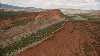 AX130_334 - 5.5K aerial stock footage of panning across the top of a mesa, Capitol Reef National Park, Utah