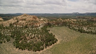 AX130_343E - 5.5K aerial stock footage flyover desert canyons, Dixie National Forest, Utah
