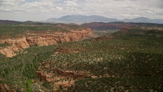 AX130_349 - 5.5K aerial stock footage flyby wide canyon, desert vegetation, Dixie National Forest, Utah