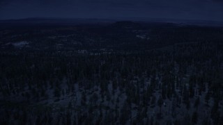 AX130_357_DFN - Aerial stock footage of 4K day for night color corrected aerial footage of flying by mountains, valleys, Dixie National Forest, Utah