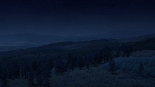 AX130_360_DFN - Aerial stock footage of 4K day for night color corrected aerial footage of flying over mountain ridge, approaching mountains, Dixie National Forest, Utah