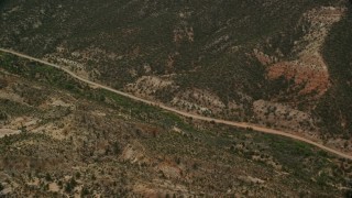 AX130_391E - 5.5K aerial stock footage pan across Hells Backbone Road, Grand Staircase-Escalante National Monument, Utah