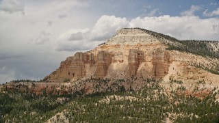 AX130_401 - 5.5K stock footage aerial video of flying by the side of Barney Top Mesa, Utah