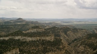 AX130_417E - 5.5K aerial stock footage of flying by mountain ridges, Grand Staircase-Escalante National Monument, Utah