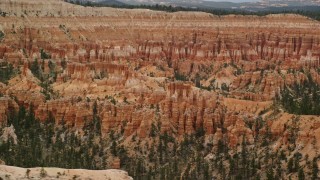 AX130_432 - 5.5K aerial stock footage of flying by hoodoos and buttes, Bryce Canyon National Park, Utah