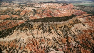 AX130_441 - 5.5K stock footage aerial video of flying by a mesa, hoodoos and buttes, Bryce Canyon National Park, Utah
