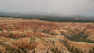 AX130_473E - 5.5K aerial stock footage of groups of hoodoos and buttes at Bryce Canyon National Park, Utah