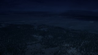 AX130_492_DFN - Aerial stock footage of 4K day for night color corrected aerial footage of flying by forest and valleys outside the national park, Bryce Canyon National Park, Utah