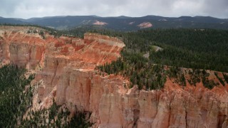 AX131_023 - 5.5K aerial stock footage flyby and pan across rock formations, Pink Cliffs, Bryce Canyon National Park, Utah