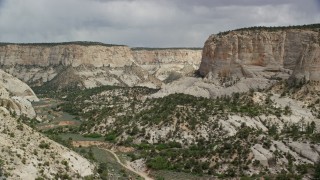 AX131_053 - 5.5K aerial stock footage of flying low through canyon, Grand Staircase-Escalante National Monument, Utah
