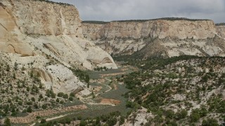 AX131_054E - 5.5K aerial stock footage of winding through canyon, Grand Staircase-Escalante National Monument, Utah