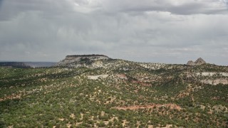 AX131_071 - 5.5K aerial stock footage of flying by small mesa, hills, Grand Staircase-Escalante National Monument, Utah