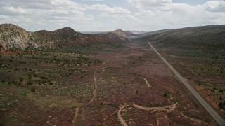AX131_084E - 5.5K aerial stock footage of flying by light traffic on Highway 89, Glen Canyon National Recreation Area, Utah, Arizona