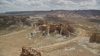 AX131_123 - 5.5K aerial stock footage of flying by rocky buttes at Glen Canyon National Recreation Area, Utah, Arizona