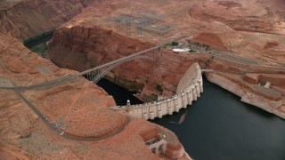AX131_136 - 5.5K stock footage aerial video of orbiting the Glen Canyon Dam and Bridge, Arizona