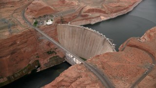 AX131_138 - 5.5K stock footage aerial video orbit around the Glen Canyon Dam and Bridge, Arizona