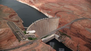 AX131_140 - 5.5K stock footage aerial video of circling the Glen Canyon Dam and Bridge, Arizona