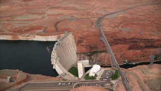 AX131_141 - 5.5K stock footage aerial video of circling above the Glen Canyon Dam and Bridge, Arizona
