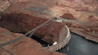 AX131_143 - 5.5K stock footage aerial video orbit above the Glen Canyon Dam and Bridge, Arizona