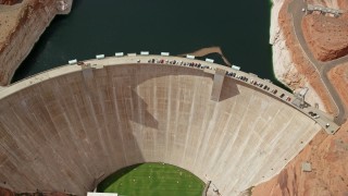 AX131_148 - 5.5K stock footage aerial video tilt to bird's eye view of Glen Canyon Dam and Bridge, Arizona