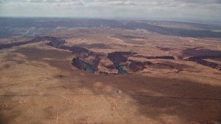 AX131_172E - 5.5K aerial stock footage of approaching Horseshoe Bend, and the Colorado River in Glen Canyon, Arizona