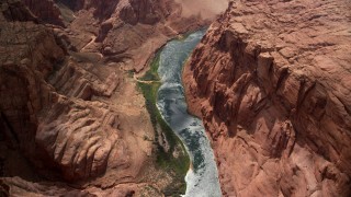 AX131_189 - 5.5K stock footage aerial video of a bird's eye view of Colorado River, rugged cliffs, Glen Canyon, Arizona