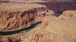 AX131_198E - 5.5K aerial stock footage of flying over Colorado River through Glen Canyon, Arizona