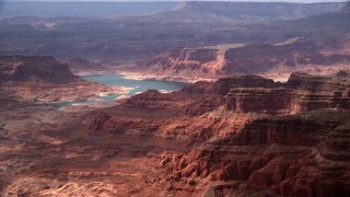 AX132_024 - 5.5K stock footage aerial video of a wide view of mesas bordering Lake Powell, Navajo Nation Reservation, Utah