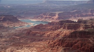 AX132_024E - 5.5K aerial stock footage of a wide view of mesas bordering Lake Powell, Navajo Nation Reservation, Utah