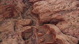 AX132_031 - 5.5K aerial stock footage of a bird's eye view of a stone bridge and dry riverbed, Rainbow Bridge National Monument, Utah