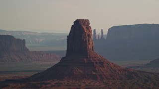 AX133_022E - 5.5K aerial stock footage of passing by East Mitten Butte, Monument Valley, Utah, Arizona, twilight