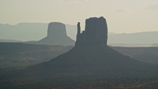 AX133_026E - 5.5K aerial stock footage of West Mitten Butte in Monument Valley, Utah, Arizona, twilight