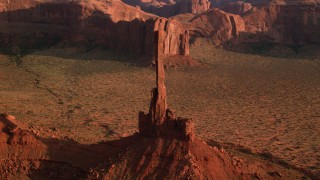 AX133_040 - 5.5K stock footage aerial video of orbiting Totem Pole Butte, Monument Valley, Utah, Arizona, twilight