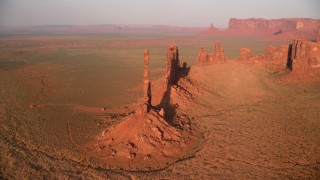 AX133_042 - 5.5K stock footage aerial video orbit buttes in the desert, Monument Valley, Utah, Arizona, twilight