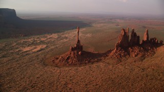 AX133_044 - 5.5K stock footage aerial video of an orbit of buttes in desert valley, Monument Valley, Utah, Arizona, twilight
