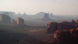 AX133_049 - 5.5K stock footage aerial video flyby buttes and mesas in Monument Valley, Utah, Arizona, twilight