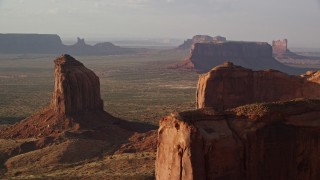 AX133_076E - 5.5K aerial stock footage of Gray Whiskers Butte in Monument Valley, Utah, Arizona, twilight