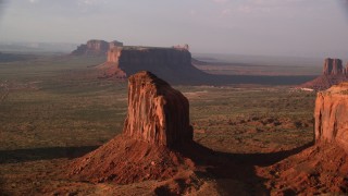 AX133_077 - 5.5K stock footage aerial video of Gray Whiskers Butte in Monument Valley, Utah, Arizona, twilight
