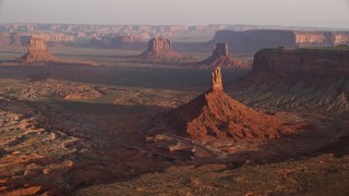 AX133_133E - 5.5K aerial stock footage approach and tilt to Big Indian Butte in Monument Valley, Utah, Arizona, twilight