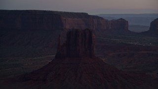 AX134_061 - 5.5K aerial stock footage of West Mitten Butte in Monument Valley, Utah, Arizona, twilight
