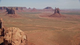 AX135_031 - 5.5K aerial stock footage of approaching several buttes from Cly Butte in Monument Valley, Utah, Arizona