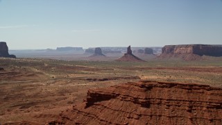 AX135_062 - 5.5K aerial stock footage of a view of Big Indian Butte and Sentinel Mesa, Monument Valley, Utah, Arizona
