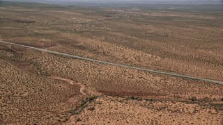 AX135_073E - 5.5K aerial stock footage of Highway 163 and Forrest Gump Point in Monument Valley, Utah, Arizona
