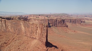 AX135_149E - 5.5K aerial stock footage of flying over top over Meridian Butte in Monument Valley, Utah, Arizona