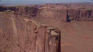 AX135_150 - 5.5K stock footage aerial video of approaching Meridian Butte, tilt to top of the butte, Monument Valley, Utah, Arizona
