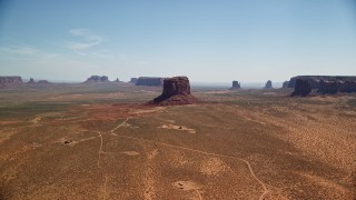 AX135_194 - 5.5K aerial stock footage of a wide view of open desert, mesas and buttes, Monument Valley, Arizona, Utah